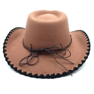Detail of western fedora hat featuring black stitched edge and dark brown cord band