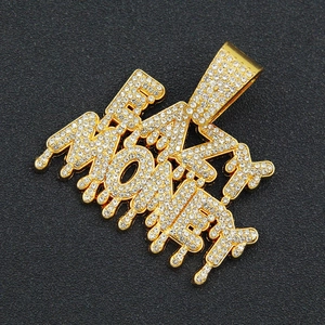 Detailed view of the FAST MONEY gold teardrop pendant with sparkling crystal rhinestones