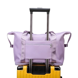 Large purple foldable travel gym bag with functional trolley sleeve attachment