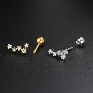 Macro view of wave star stud earrings showing precision screw back closure detail