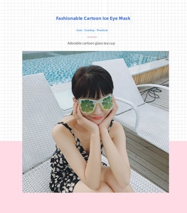 Model wearing a green lemon pattern cooling gel eye mask by a summer swimming pool