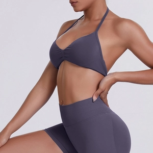Detail of high-elasticity halter sports bra and leggings with delicate micro-pleat texture