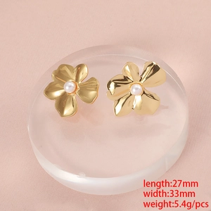 Gold stainless steel flower earrings with center pearl on display stand with dimensions