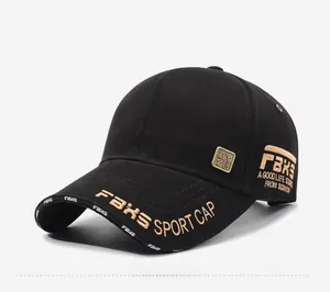 Detail of black baseball cap with gold embroidery and Chinese style square emblem