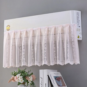 Detail of pink lace air conditioner cover with floral embroidery and scalloped edges