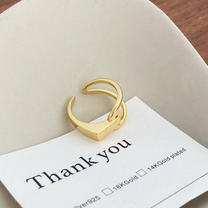 Detailed macro view of S925 sterling silver geometric ring on a white card