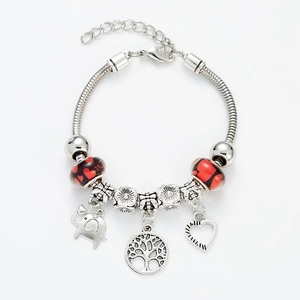Silver tree of life charm bracelet with red heart beads and elephant pendants
