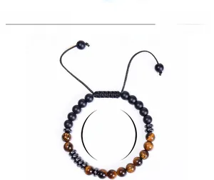 Detail view of 6mm tiger eye and matte black beads with adjustable cord measurements