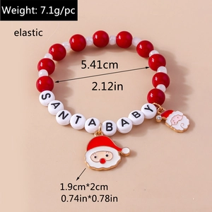Detailed view of Santa Baby beaded bracelet with red pearls and Santa Claus enamel charms