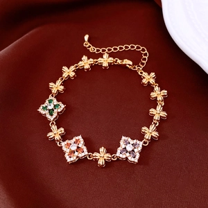 Detailed close-up of 18K gold plated flower bracelet with colorful gemstones and zircon