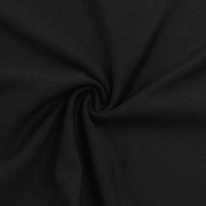 Macro detail of high-quality black textile fabric with smooth texture and soft drape