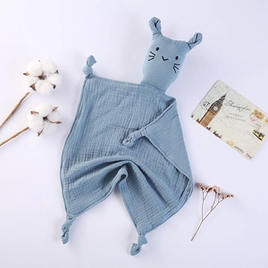 Detail of blue double-layer cotton muslin baby security blanket with cat toy and knotted corners