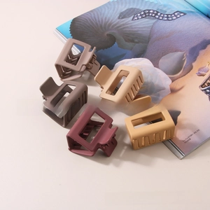Set of five rectangle matte hair claws in Morandi colors on a fashion magazine
