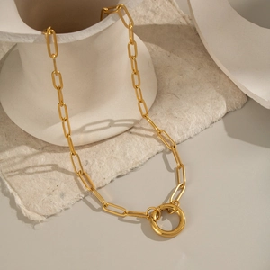 Chunky 18K gold plated stainless steel chain necklace on aesthetic white studio background