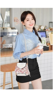 Chic checkered crossbody mini bag shown on model with floral scarf and gold hardware