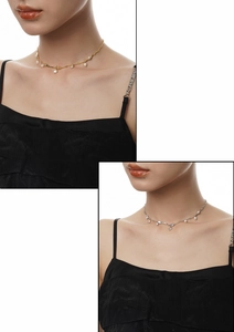 Detail of delicate S925 silver pearl pendant necklace in gold and silver finishes
