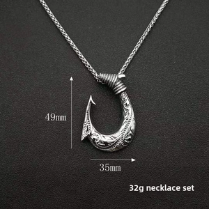 Detail of Viking fish hook pendant with vintage carvings and 49mm x 35mm size markings