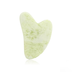 Close-up of a light green heart-shaped resin gua sha tool with reflective white background