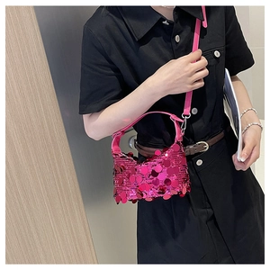 Close-up of vibrant rose red sequin handbag with premium texture and matching strap