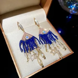 Sparkling zircon star and waterdrop tassel earrings with navy blue beaded fringe detail