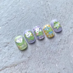 Close-up of 5D embossed nail stickers featuring cute rabbits and floral patterns