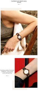 Detail of wooden watch featuring a multi-tone linked band and white Roman numeral dial