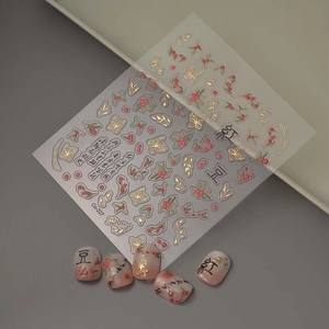 3D bronzing nail stickers with red beans, gold butterflies and liquid cherry designs