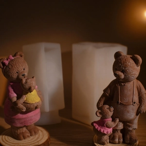 DIY bear family silicone mold for candle making showing finished wax figures on wood