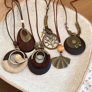 Bohemian retro wood and bronze long necklaces with tree, leaf and bird pendants
