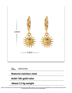Macro detail of 18k gold sun charm earrings with 2.6cm height and 1.4cm width dimensions
