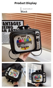 Detail of retro TV crossbody bag featuring rainbow signal screen and silver knobs