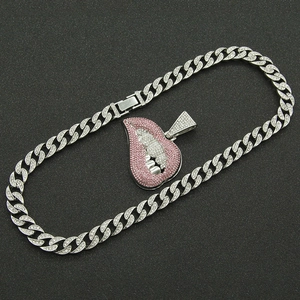 Hip hop silver Cuban chain necklace with pink rhinestone encrusted lip and teeth pendant