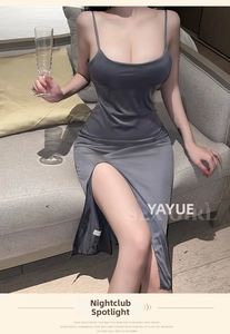 Macro view of grey satin slip dress featuring high slit and glossy silk texture