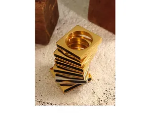 Minimalist square stacked rings with gold and silver finish and black enamel side detail