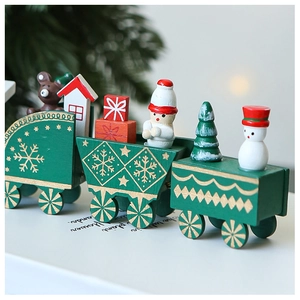 Close-up of wooden Christmas train decor with miniature snowman and bear figurines