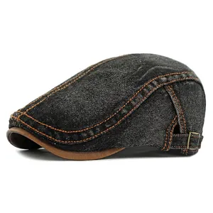 Vintage dark gray washed denim ivy cap with brown leather trim and metal buckle