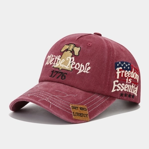 Detailed embroidery showing 'We the People' and '1776' on a vintage washed baseball cap