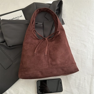 Large dark brown matte shoulder bag with a bow detail and high capacity for work commuting