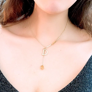 Minimalist gold titanium steel necklace featuring letter D and square block pendant