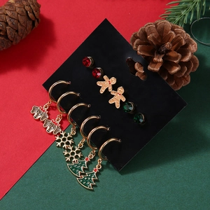 Festive Christmas earring set with gingerbread man, snowflakes and trees on gold metal