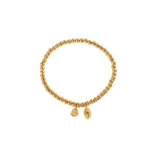 Minimalist 18k gold beaded bracelet featuring lotus pod charms in a zen jewelry style