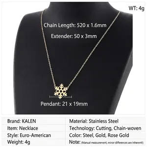 Detail view of a gold snowflake pendant necklace on a black jewelry mannequin