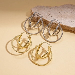 Minimalist geometric circular hoop earrings in polished gold and silver metal finishes
