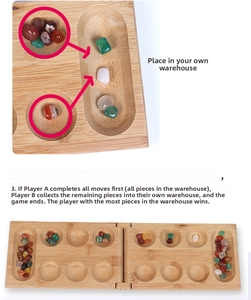 Detail of solid wood Mancala board with colorful stones and folding hinge mechanics