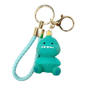 Cute cartoon green dinosaur resin keychain charm with matching braided leather strap and gold ring
