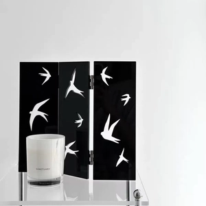 Minimalist Chinese acrylic screen with flying bird pattern and sanctuary candle decor