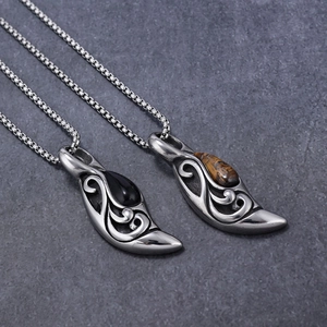 Macro view of retro stainless steel teardrop pendants with tiger eye and onyx stones