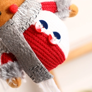 Christmas plush gnome ornament with red knit fabric and fuzzy grey beard detail