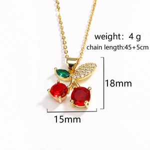 Detail view of red cherry pendant showing 15x18mm dimensions and 45cm gold chain