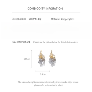 Detail view of chandelier glass tassel earrings with copper material and size measurements